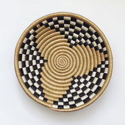 Woven basket with black, white, and beige pattern fair trade