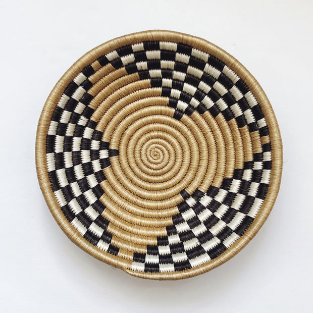 Woven basket with black, white, and beige pattern fair trade